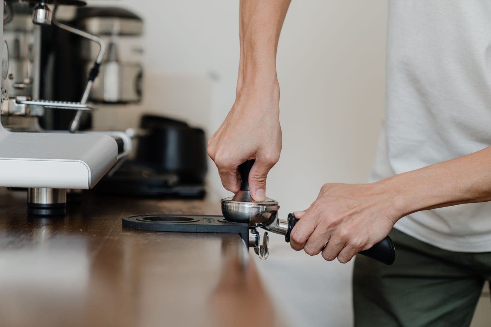 Espresso tools laid out on a kitchen counter
