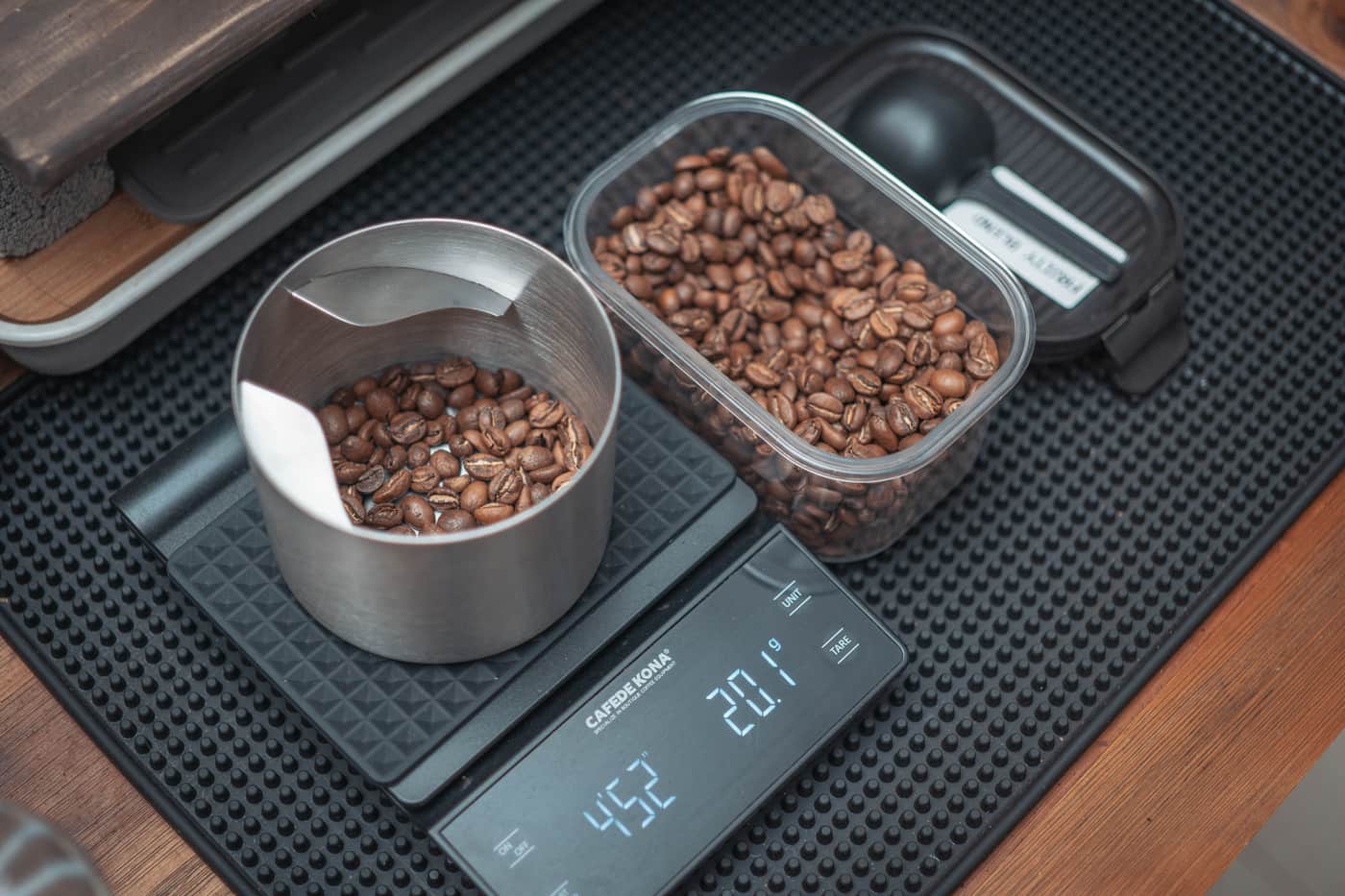 A small kitchen scale beside coffee